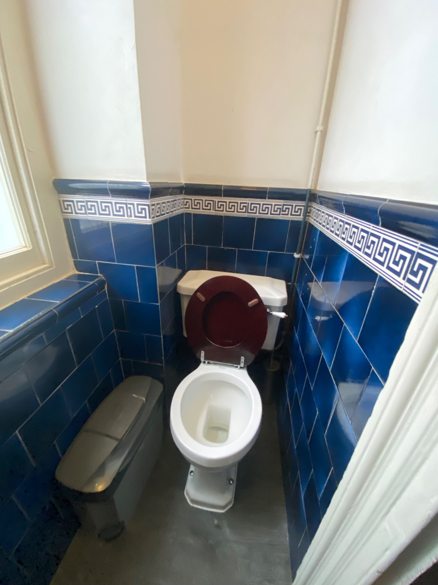 From door facing right. Toilet ahead at back.