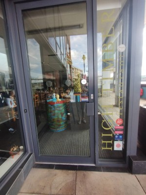 Glass door with plastic frame. Pull open, handle right.