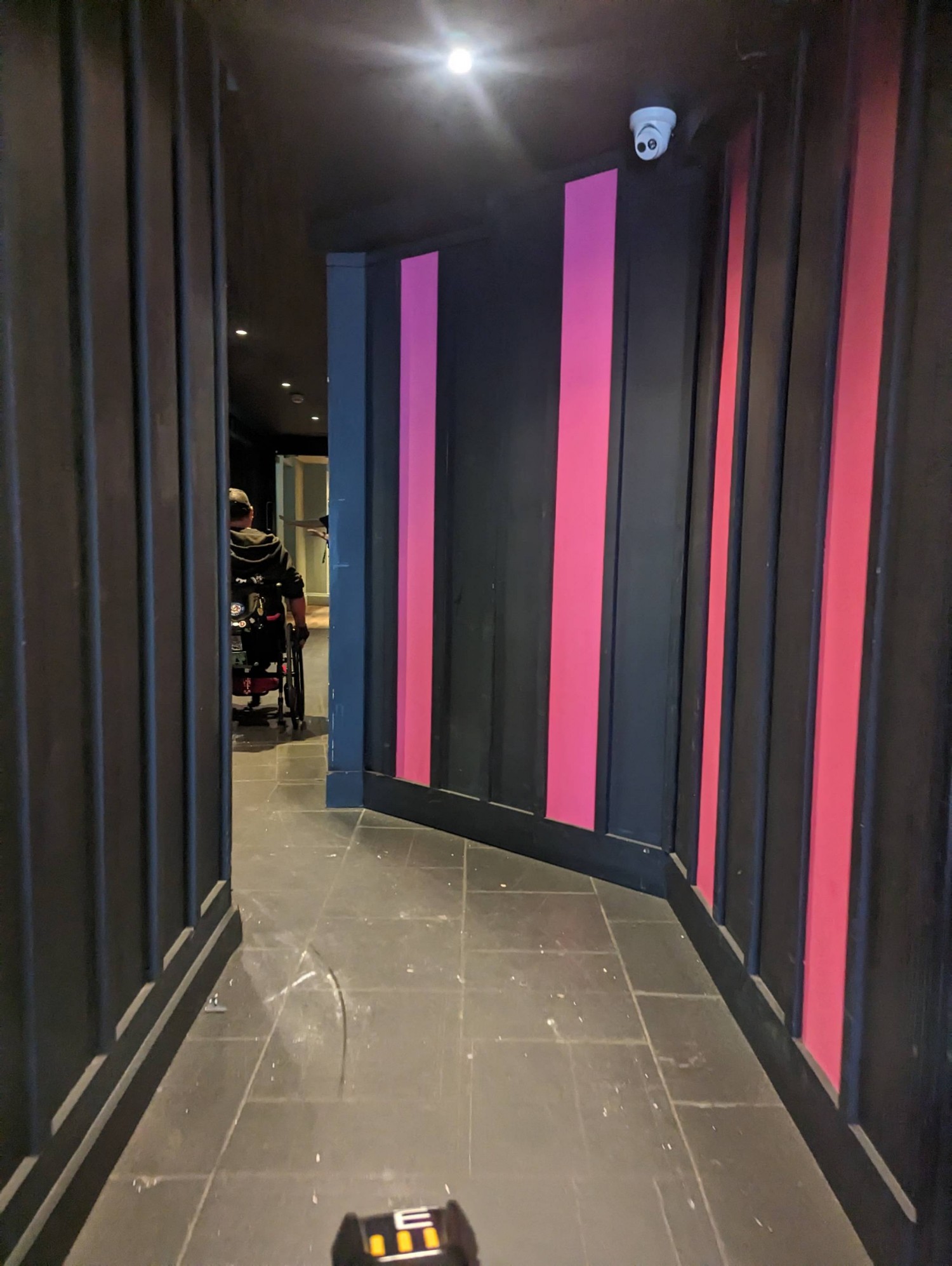 Long corridor down side of venue (sheltered)