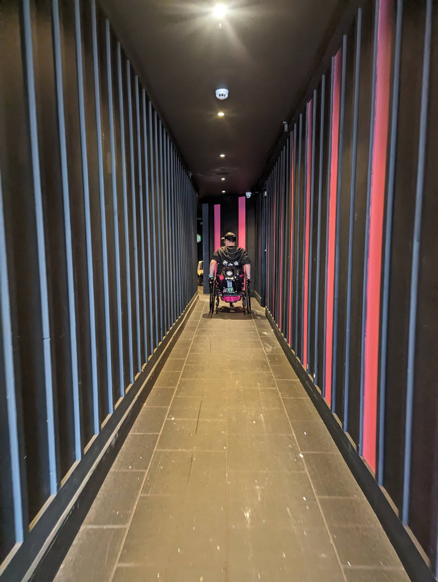 Long corridor down side of venue (sheltered)
