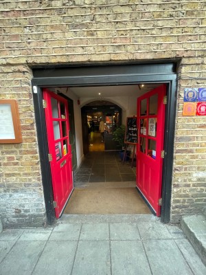 First set of double doors at main entrance. Red doors push open from the centre.