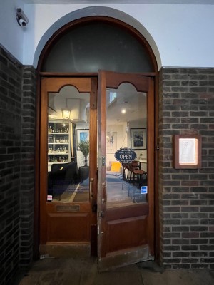 Pull glass doors handle in the middle.