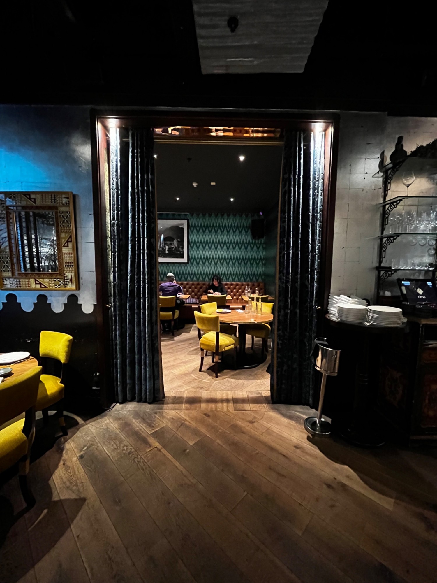 Entrance to private dining area at back of main area separated by curtain.