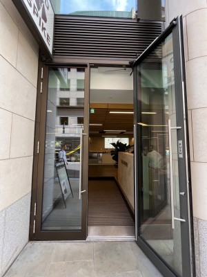 Pull glass door with handle in the middle.