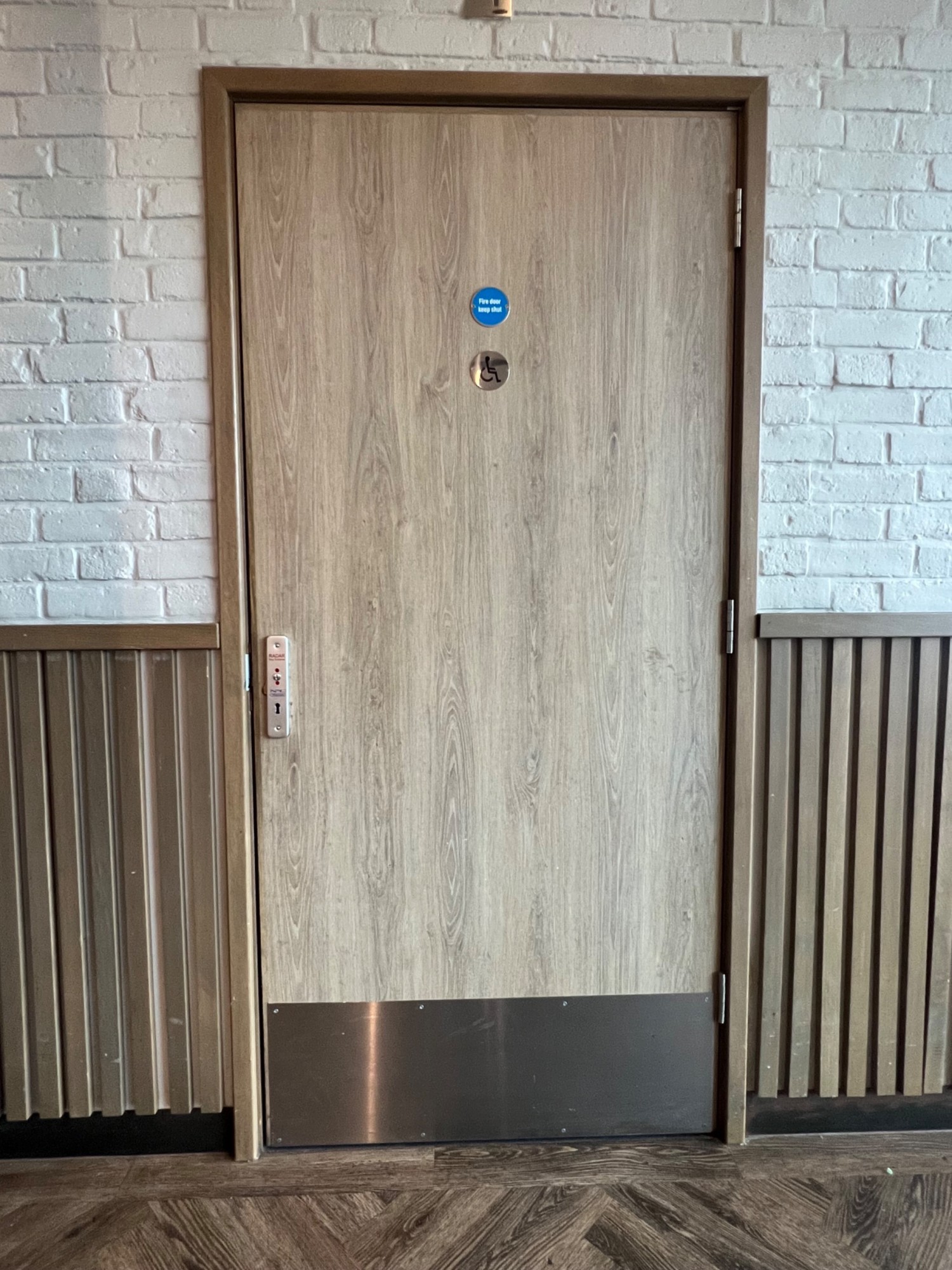 Radar key system to the left of the bathroom door. Opens outwards from left to right.
