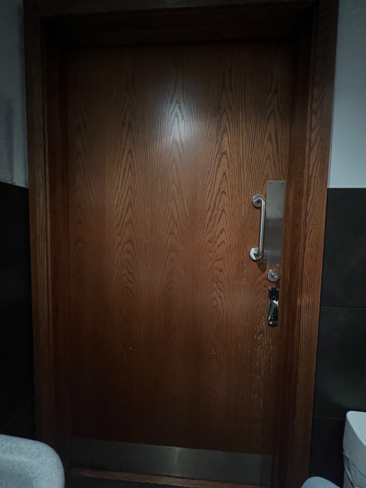 Inside of bathroom door. Handle to the right. Opens outwards right to left.