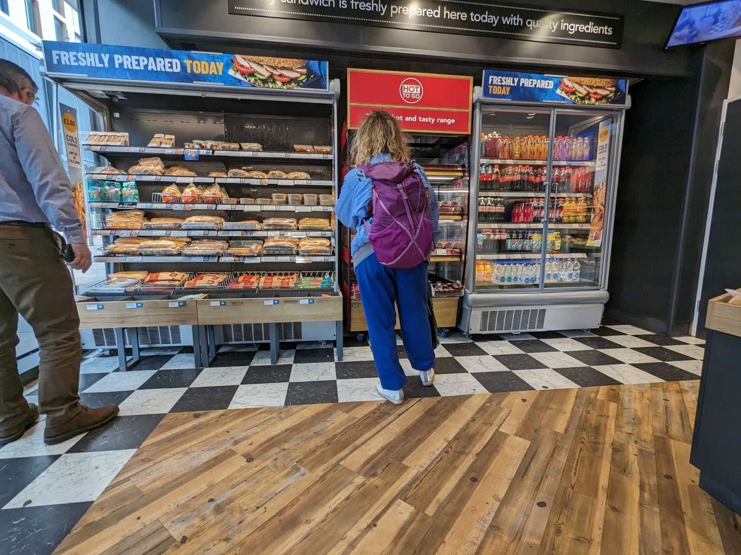 Fridge area to the left when entering. Small baskets at the base which may be an obstruction.