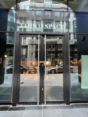 Glass push doors with handle in the middle.
