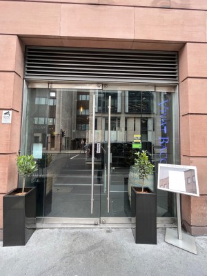 Glass pull doors with handle in the middle.