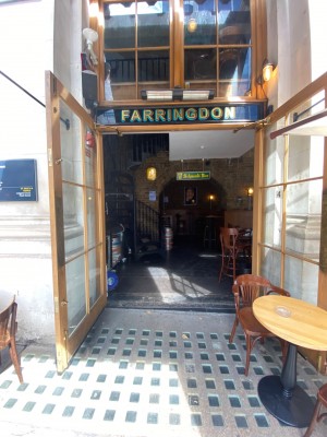 Double wooden-framed glass pull doors. Handles in middle. One step along door small to larger from left to right.