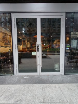 White framed glass doors. Pull silver handles in centre to open.