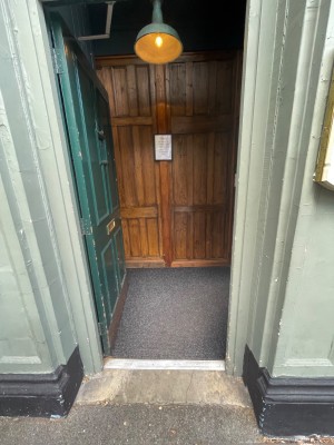 Push door from right to open. Small step before door. Then small bump.