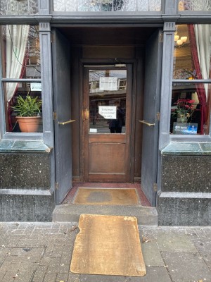 Double grey doors ahead. Push to open via handled in center.