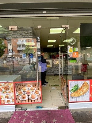 Push glass doors with handle in the middle.