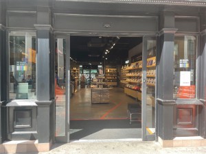 Glass doors with grey framing ahead.