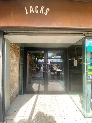 Preceding double glass pull door to the main entrance.