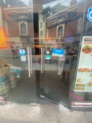 Double glass doors. Push doors open in centre.