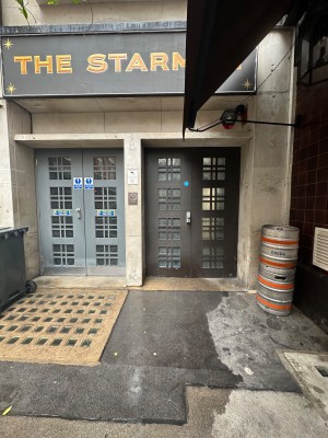 Alternative entrance. Double wood door with handle on the right on left door.