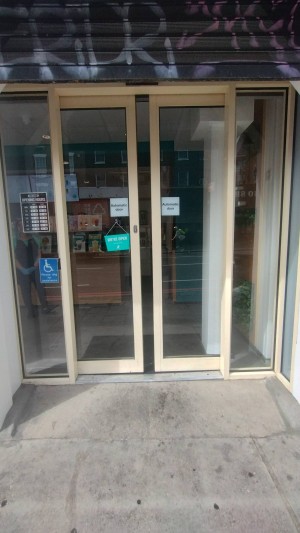 Glass doors with white frame, opens from middle.