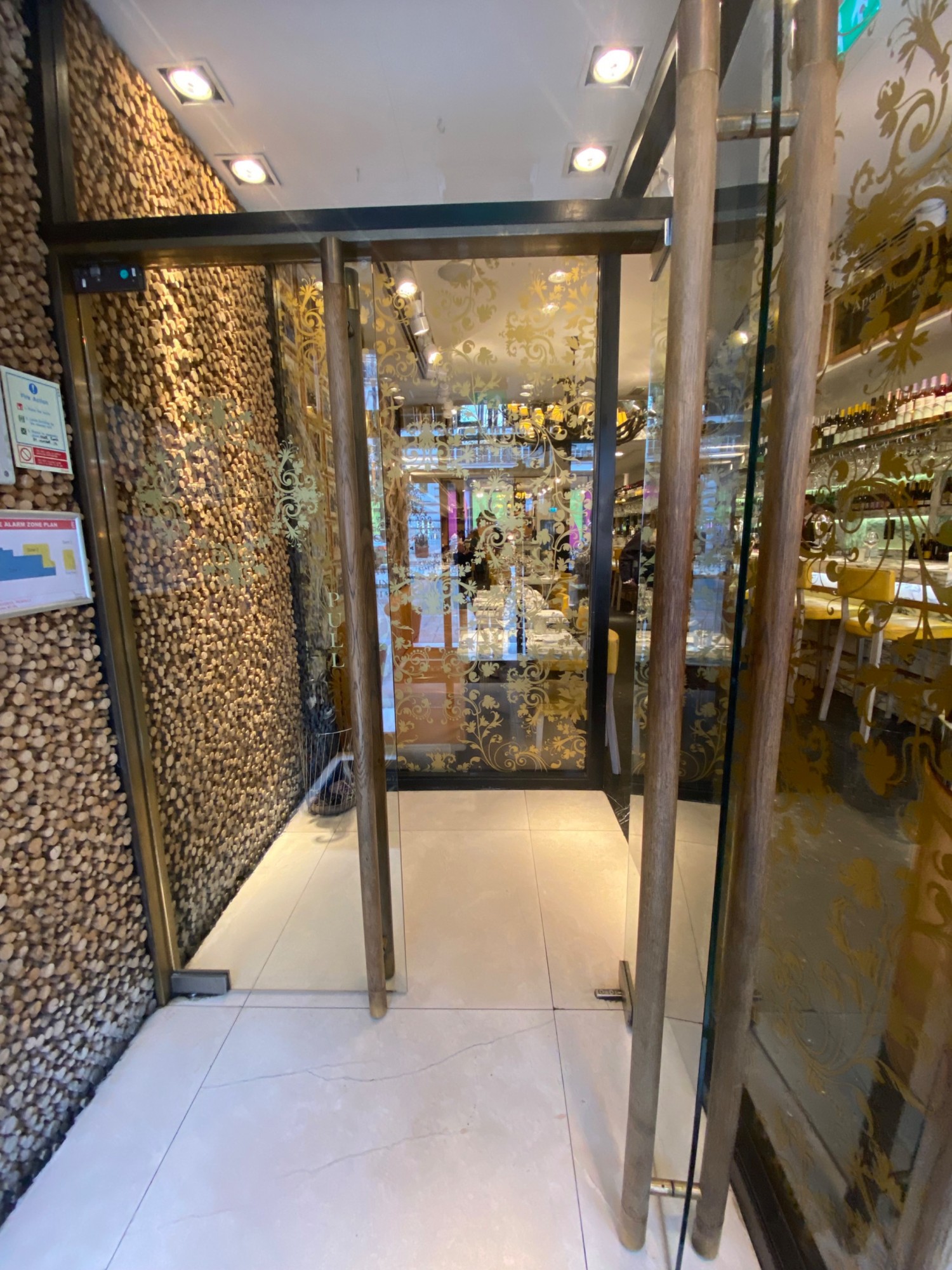 Push glass door leading to main area.