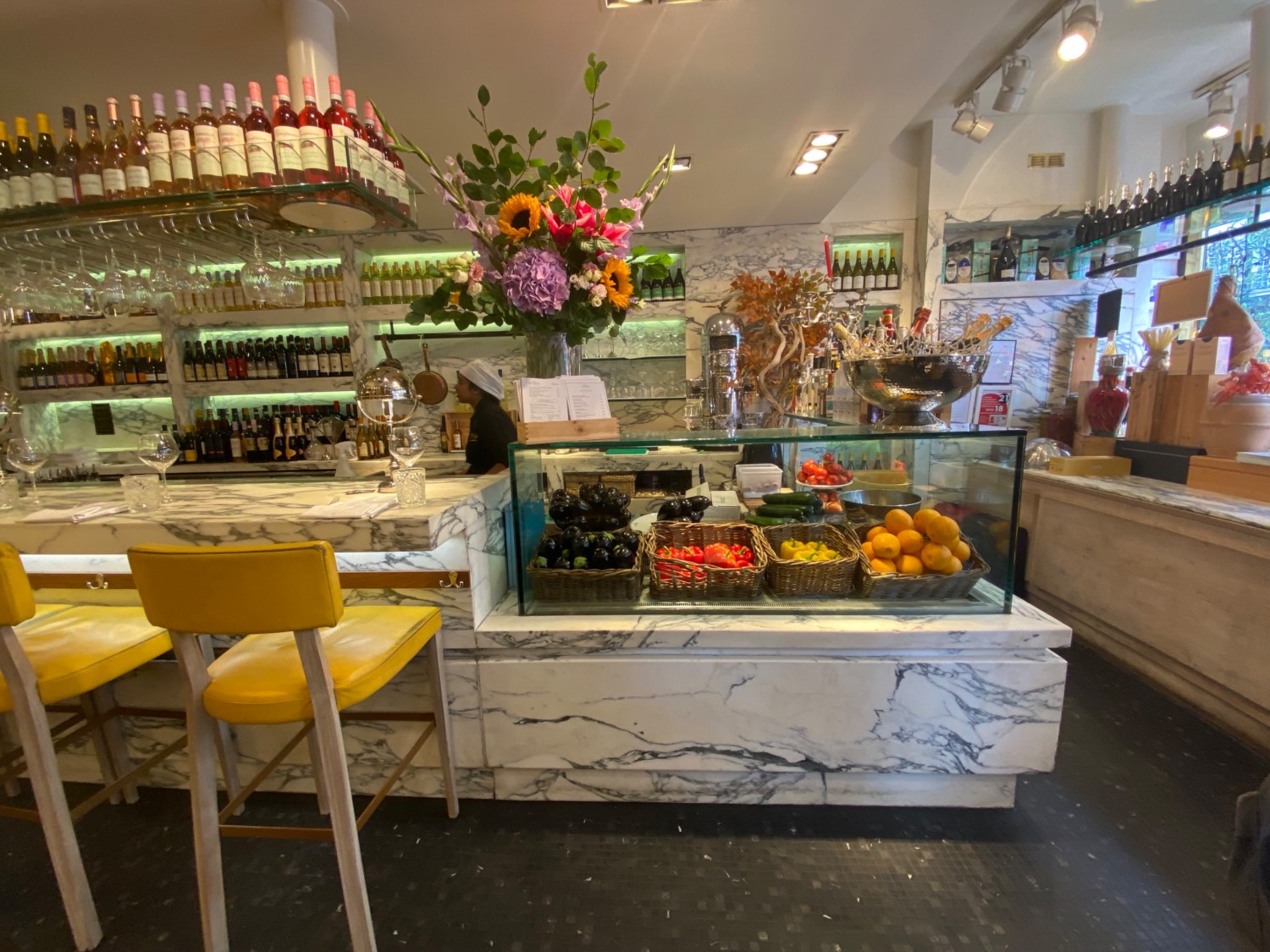 Looking straight from entrance. Open food display straight ahead. Bar counter beside it to the left.