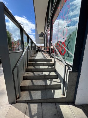 Stairs with handrail on each side.