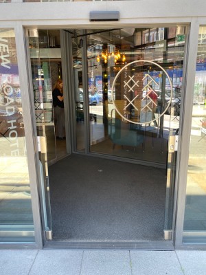 First lot of doors for entrance are grey framed glass automatic sliding doors.