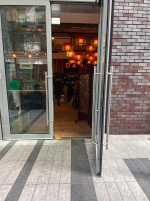 Glass door with grey frame. Pull handle in centre to open.