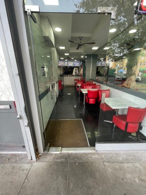 Push glass door from right to open. Small step before door.