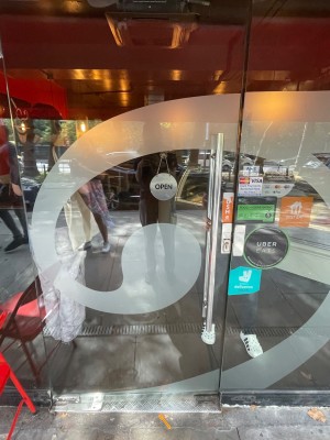 Push glass door from right to open. Small bump before door.