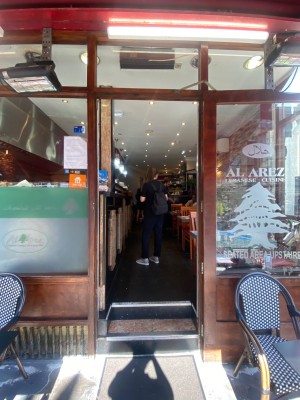 Glass door with wooden frame. Pull from left to open.