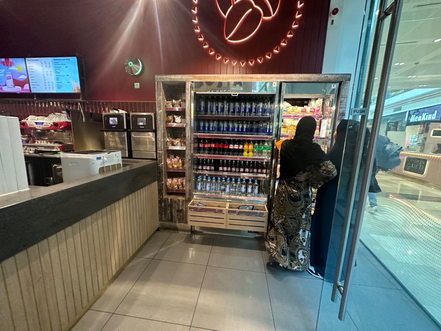 From entrance facing right. Fridge ahead. Counter along left.