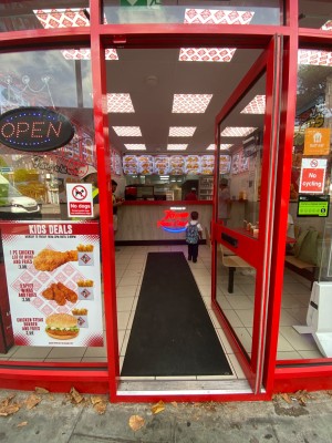 Push glass door with handle on the left.