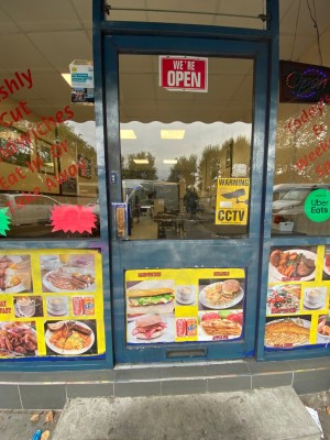 Push door with handle on the left.