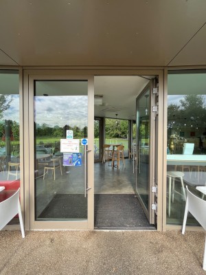 Push double glass doors with handle in middle.