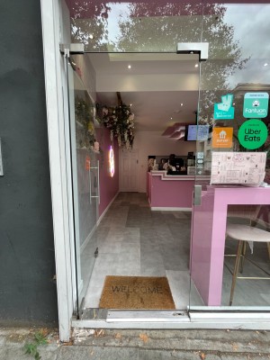 Push glass door with handle on the right.
