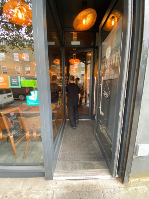 Preceding push door with handle on the left.