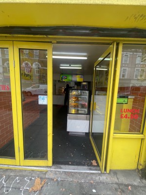 From the main area looking straight. Double glass doors. Push in the centre to enter.