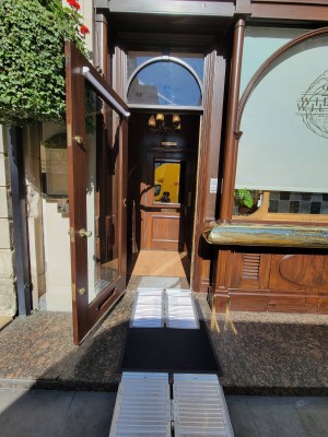 Brown and glass door. Pull to open. Handle right side.