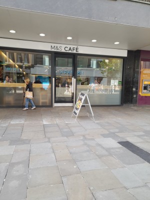 Glass door that opens inwards from right to left