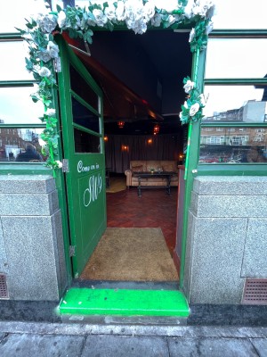 Green push door with no handle.
