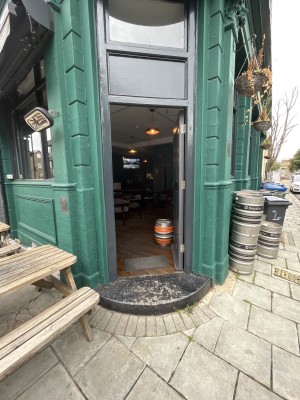 Entrance in corner of venue. Push door to open rom left side.