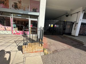 From street looking straight ahead to main entrance on the left hand side and alternative entrance on the right.