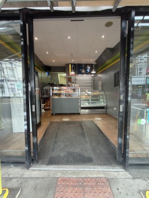 Black framed glass doors. Doors slide open from centre.
