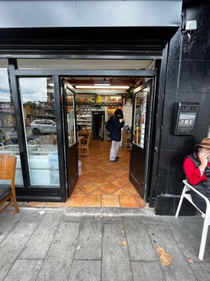 Glass doors with black frame. Push from middle to open. Small bump at foot of door.