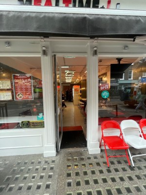 Single door, with white door frame. Push door open from the right.