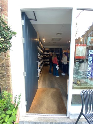 Black wooden door. Push from right to open.
