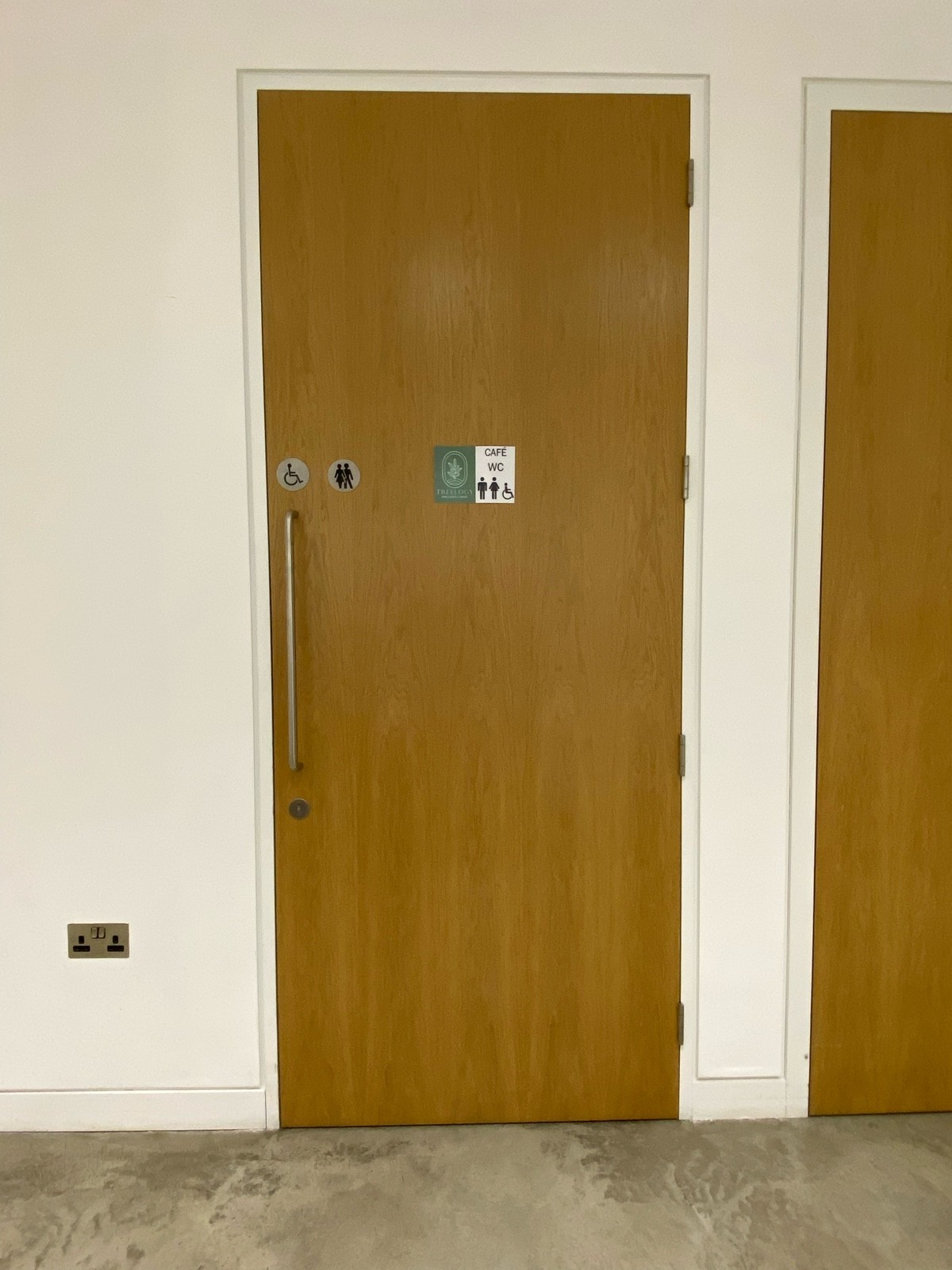 From after preceding door facing right. Pull from metal handle on left to open.