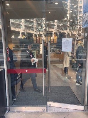 Double glass doors ahead. Pull metal handles at center of door to open.