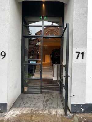 Glass double door. Pull from middle to open.